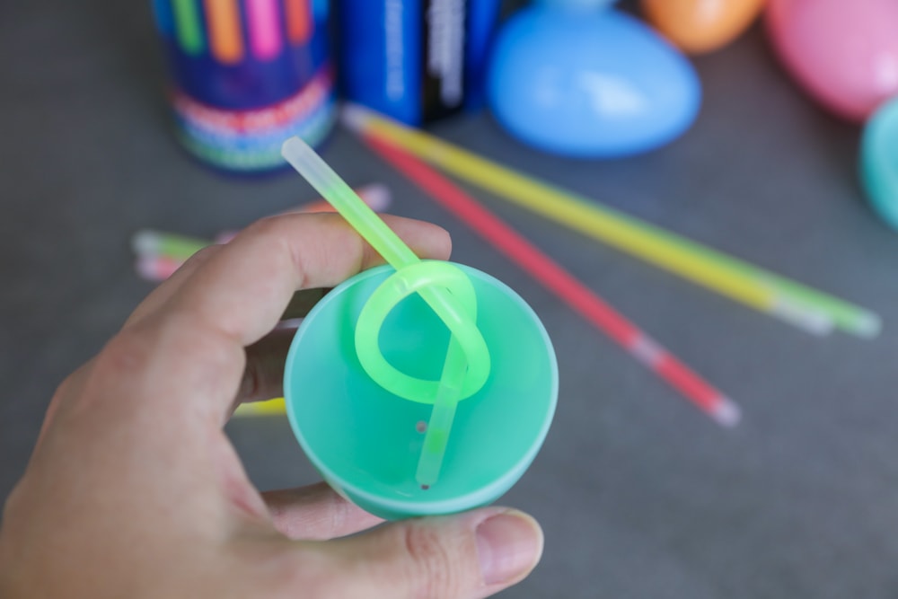 Adding a glow stick, tied in a knot, to the inside of a plastic Easter egg.