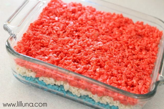 Red, white and blue rice krispie treat layers in a glass pan