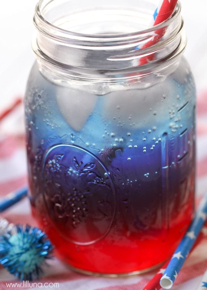 Red white and blue drink with ice in a mason jar