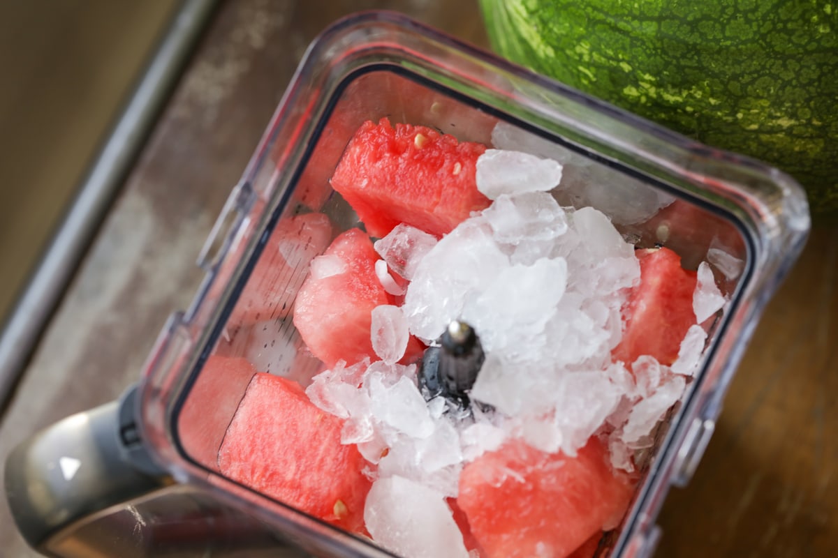 Cut watermelon and ice cubes in a blender.