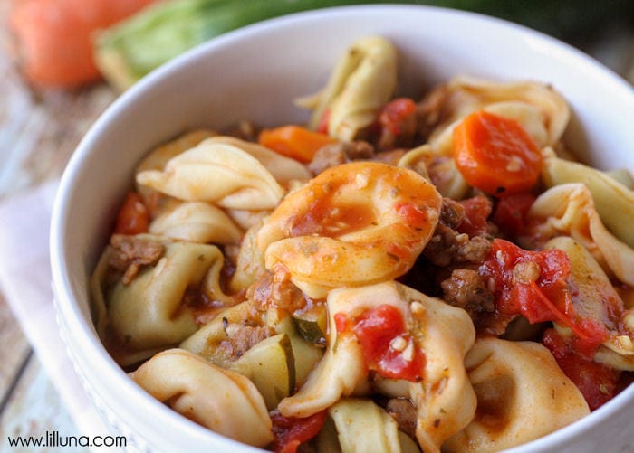 Italian Christmas Dinner ideas - a bowl filled with sausage tortellini soup.