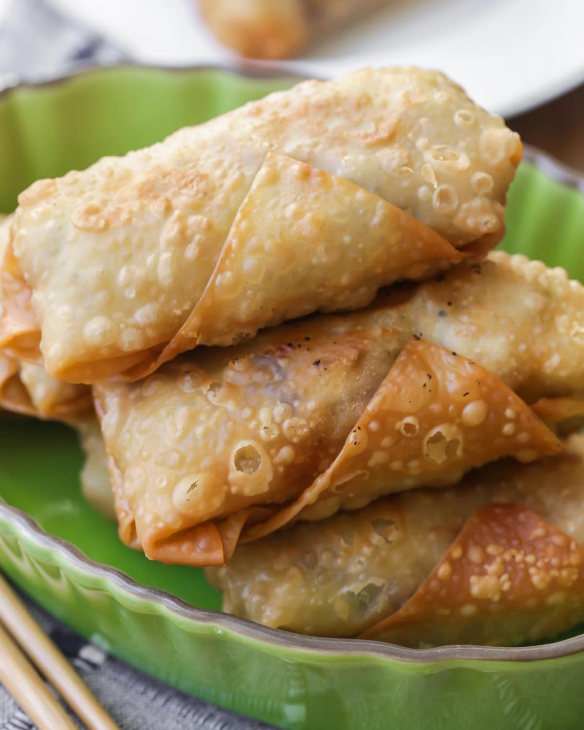 Cheesecake factory avocado egg rolls - fried egg rolls piled on a plate.