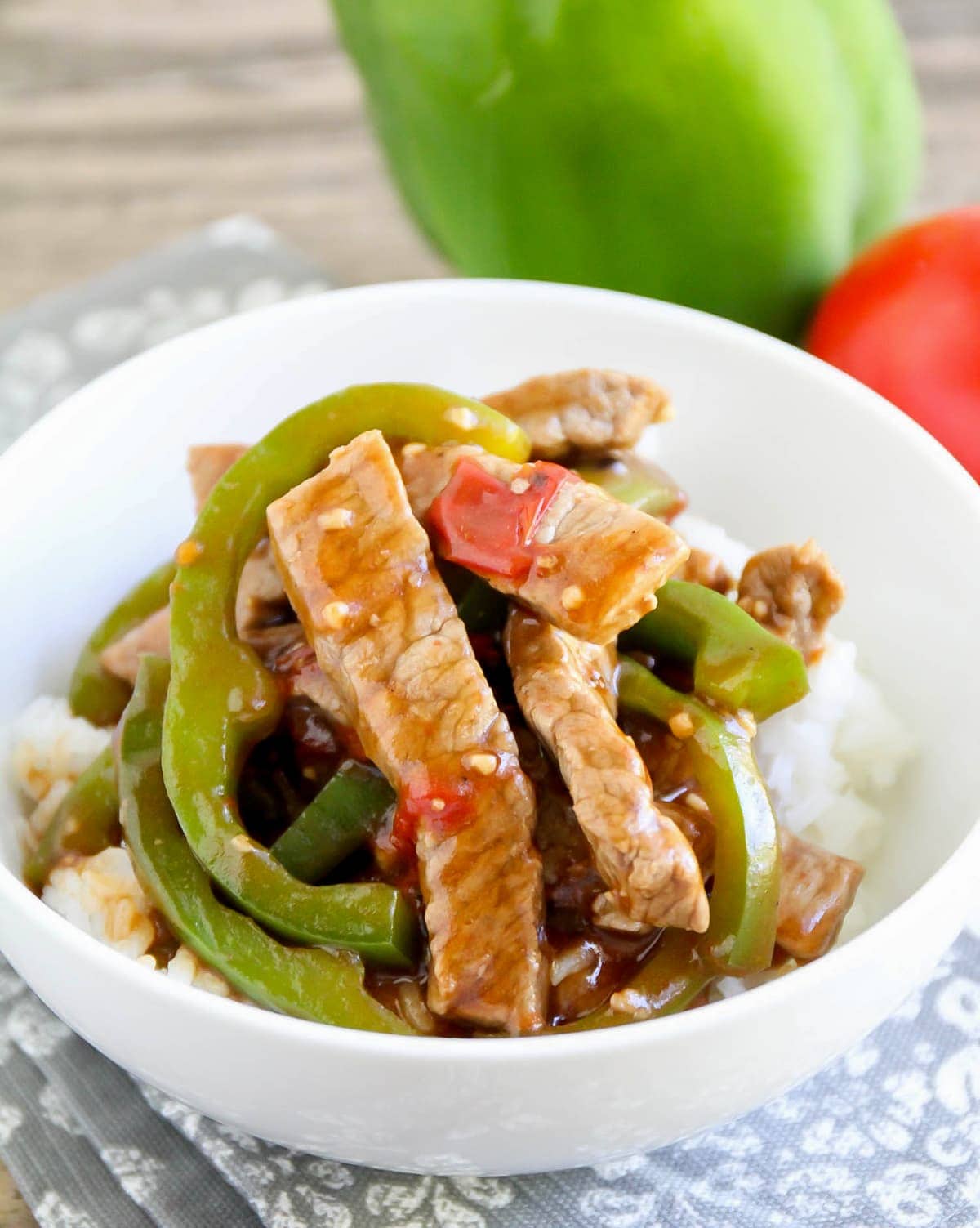 Chinese pepper steak with vegetables served over white rice