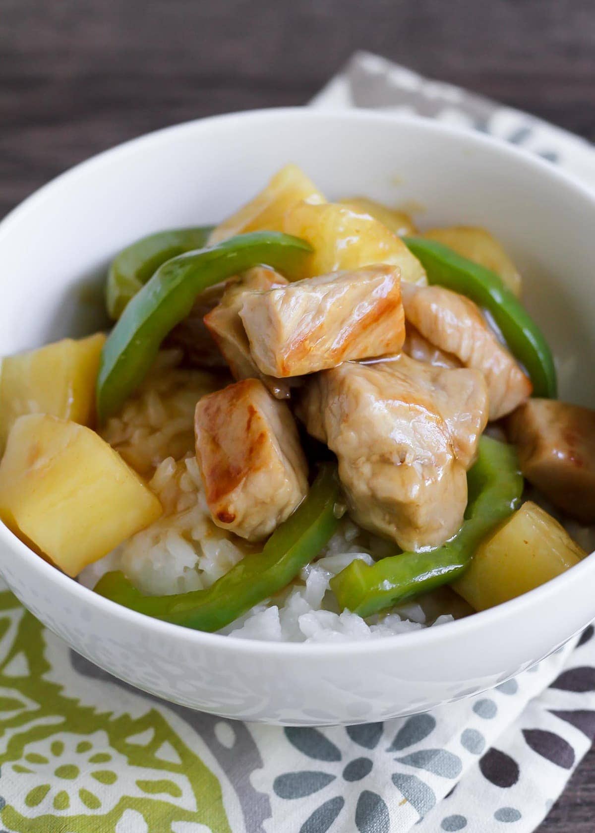 Sweet Sour Pork over white rice in a bowl