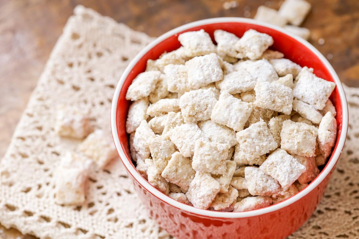 White chocolate puppy chow in red bowl