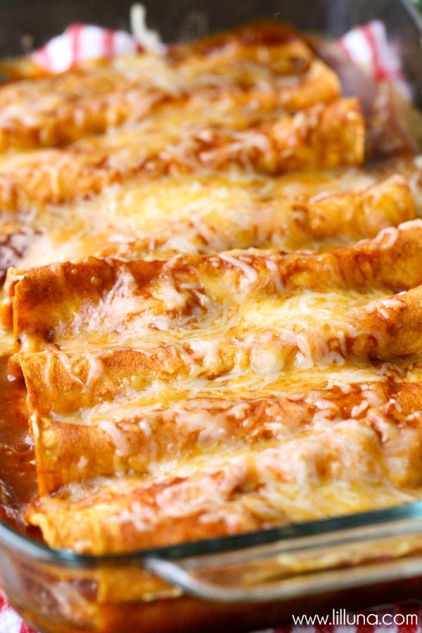 Restaurant-Style Red Cheese Enchiladas - an old family favorite recipe that is simply the best. Corn tortillas filled with cheese, tomato sauce, chile puree, salt & garlic pepper and topped with more cheese!