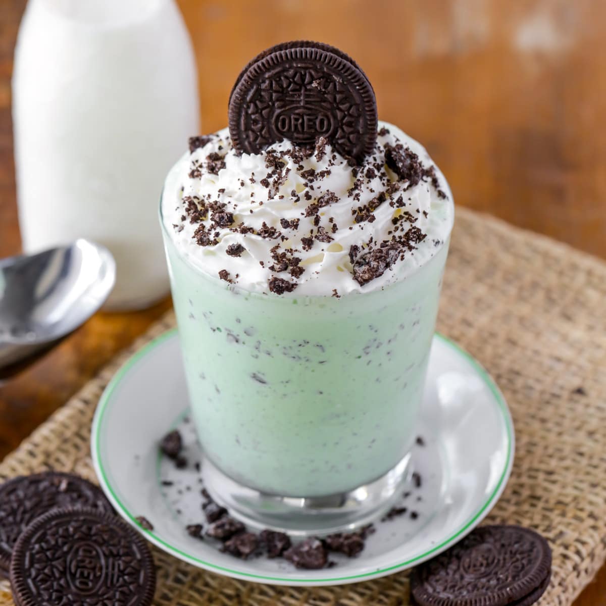 Mint chocolate chip milkshake served with whipped cream and Oreo