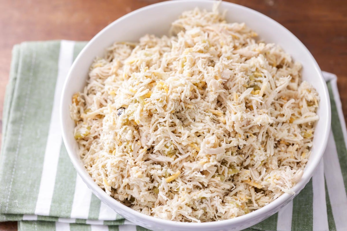 Shredded chicken prepped in a white bowl.