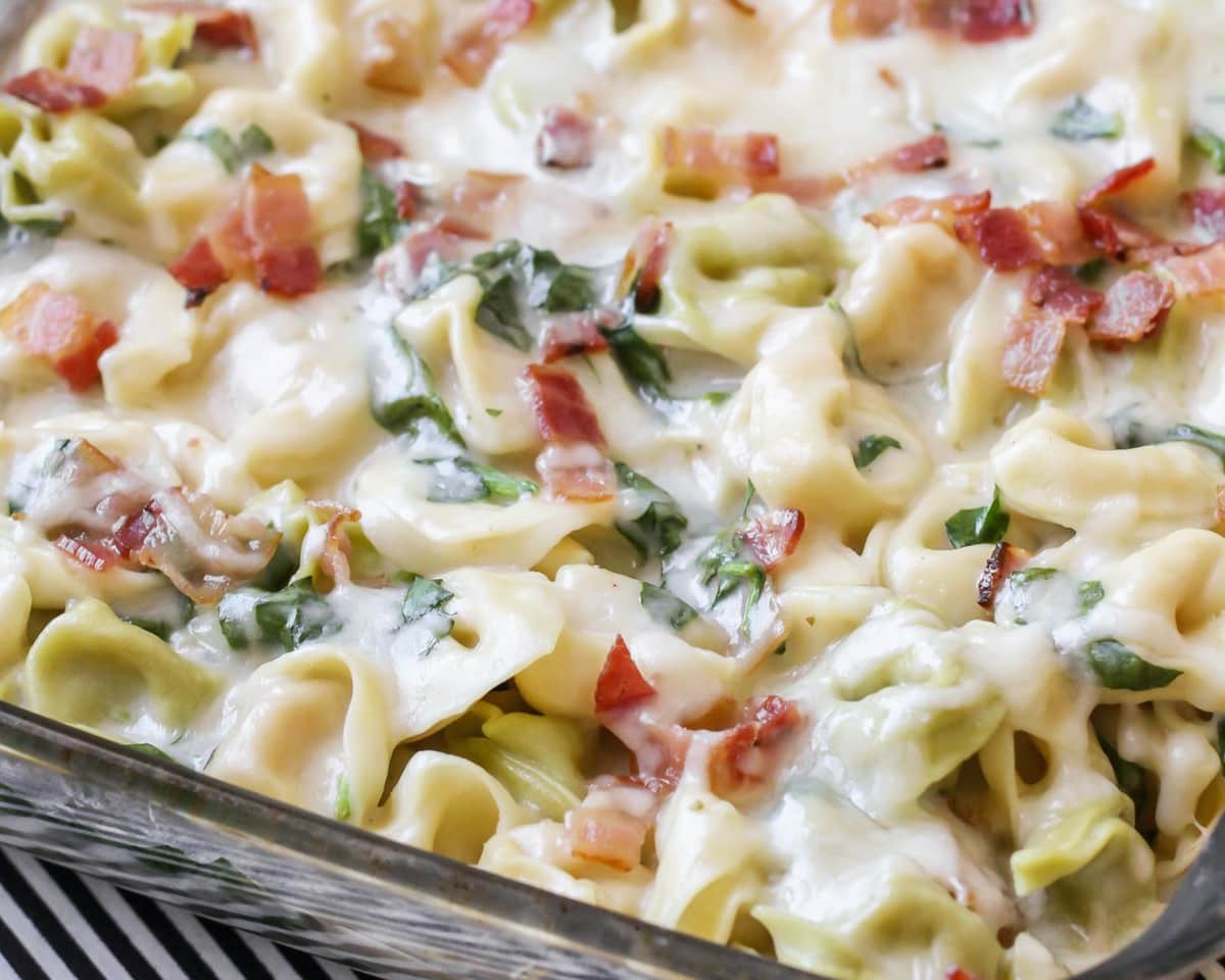 Cheesy Tortellini Bake in a glass casserole dish