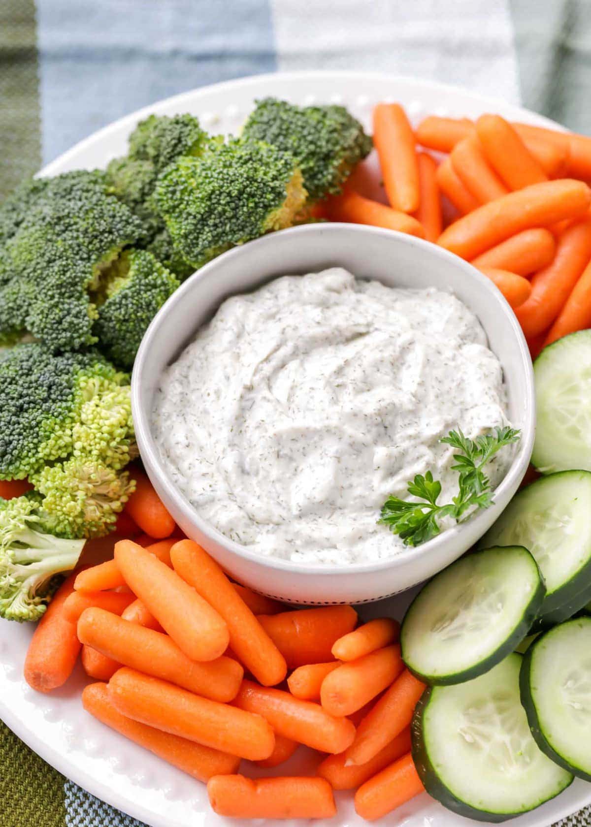 Dill Vegetable dip recipe in white bowl with veggies.