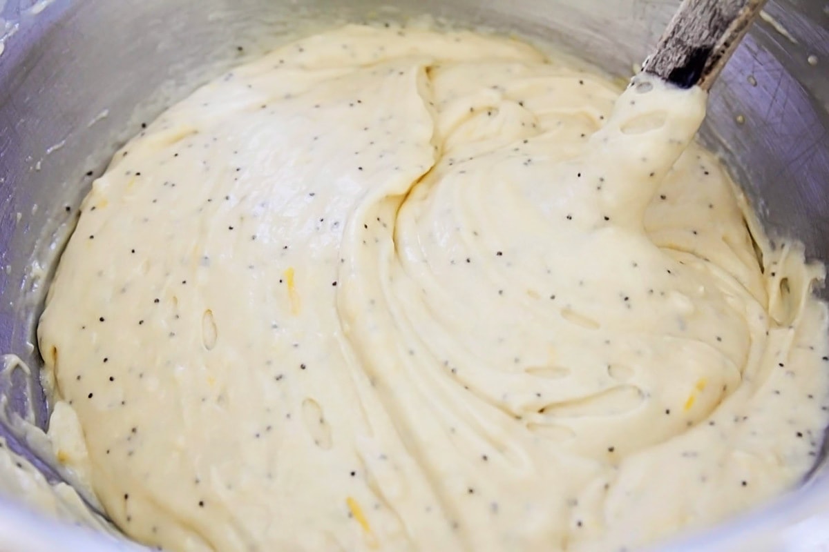 Poppyseed filled batter in a mixing bowl.