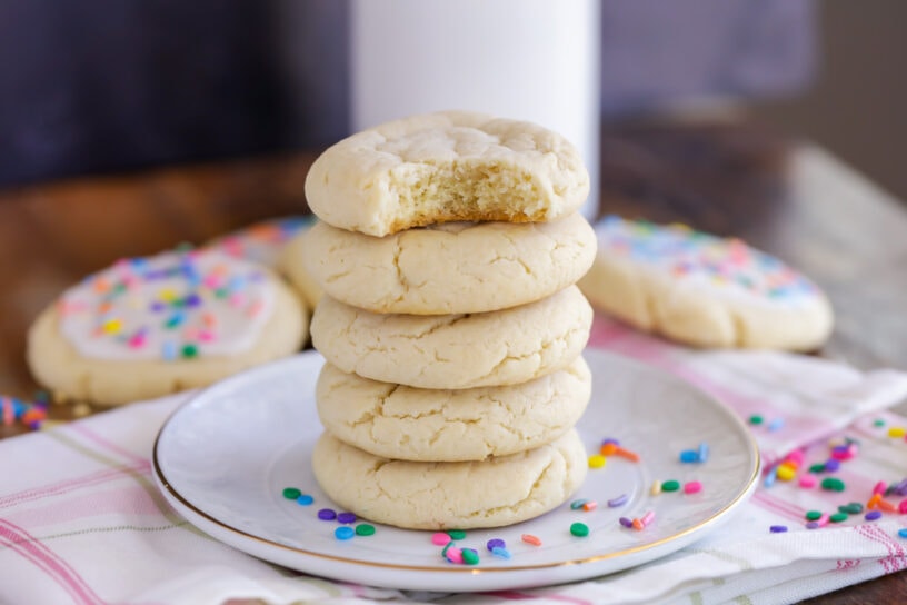Chewy sugar cookies stacked on a plate
