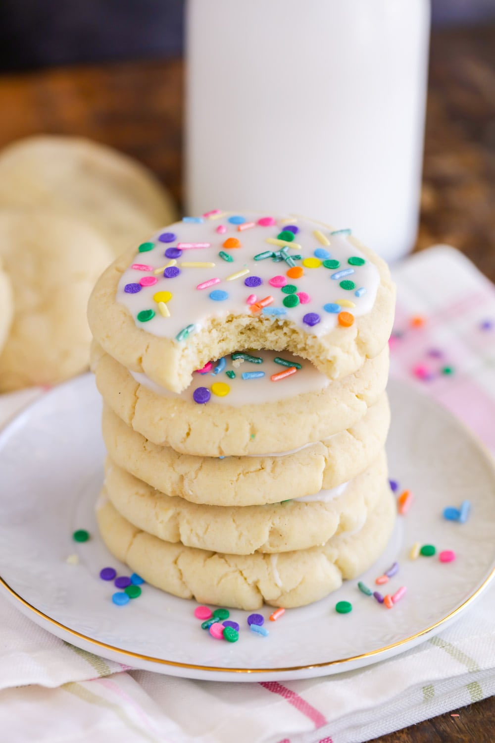 Chewy sugar cookie recipe with icing and sprinkles