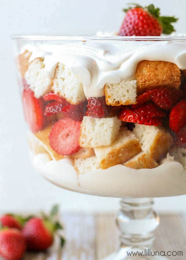 New years eve desserts - a layered strawberries and cream angel food cake trifle topped with whipped cream.