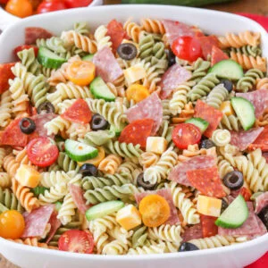 Pasta salad with Italian dressing in white bowl.