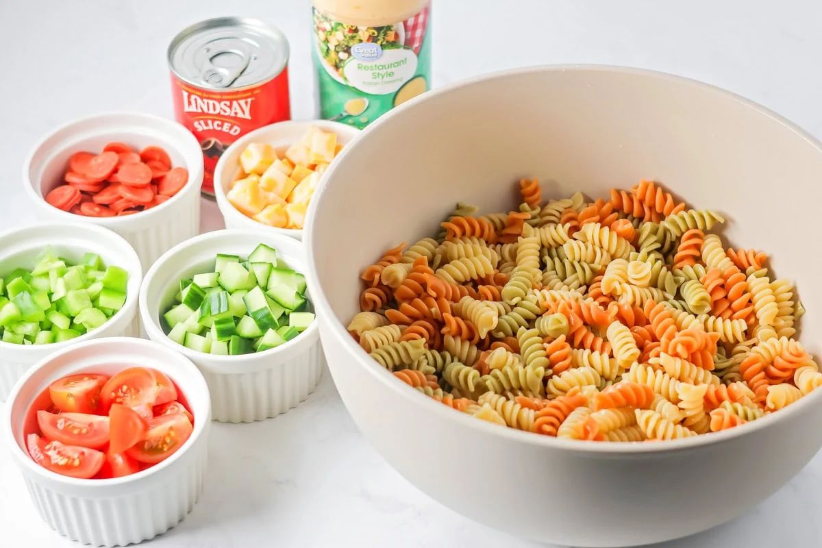 Ingredients for easy pasta salad on counter.