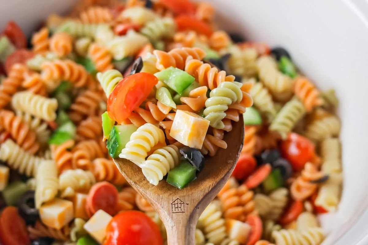 Pasta Salad with Italian Dressing mixed together in bowl.