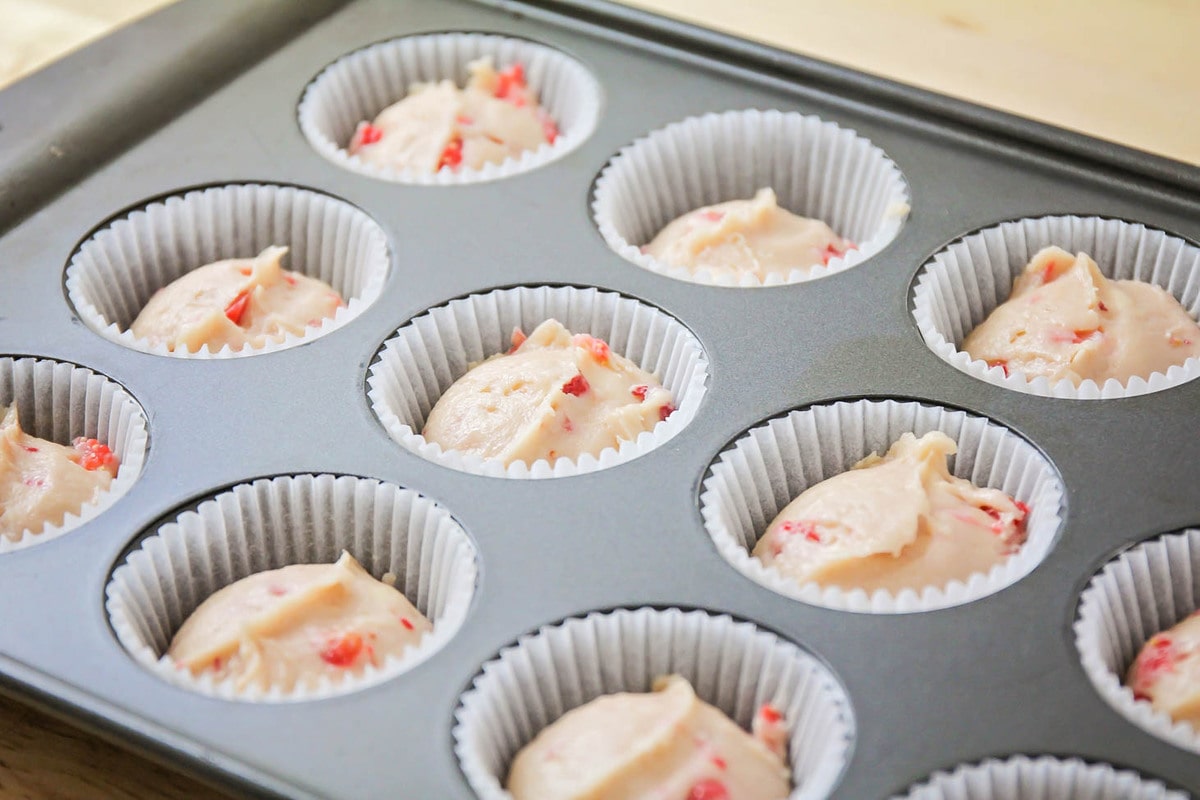 Fresh Strawberry cupcake batter in paper liners.