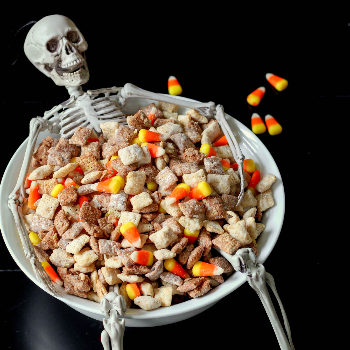 Halloween Puppy Chow in a skeleton bowl