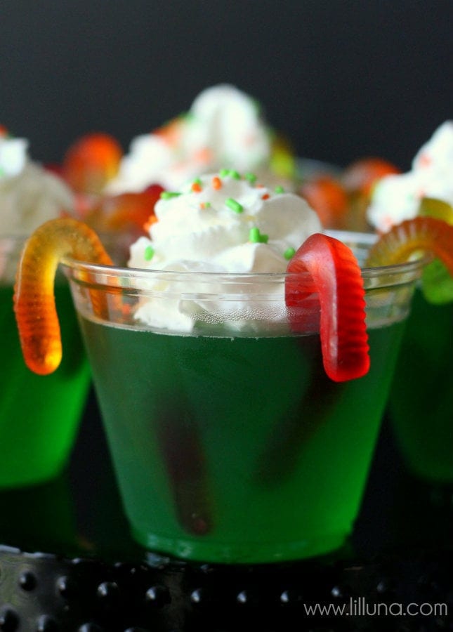 Halloween snacks - plastic cup filled with gummy worm jello cups.