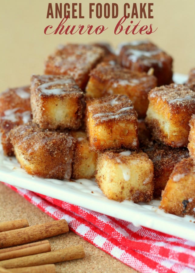 Angel Food Cake Churro Bites stacked on a white plate