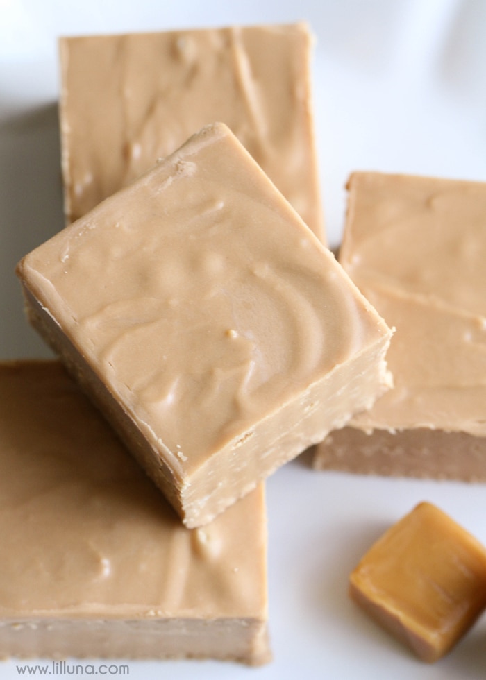 caramel apple fudge stacked on a white plate