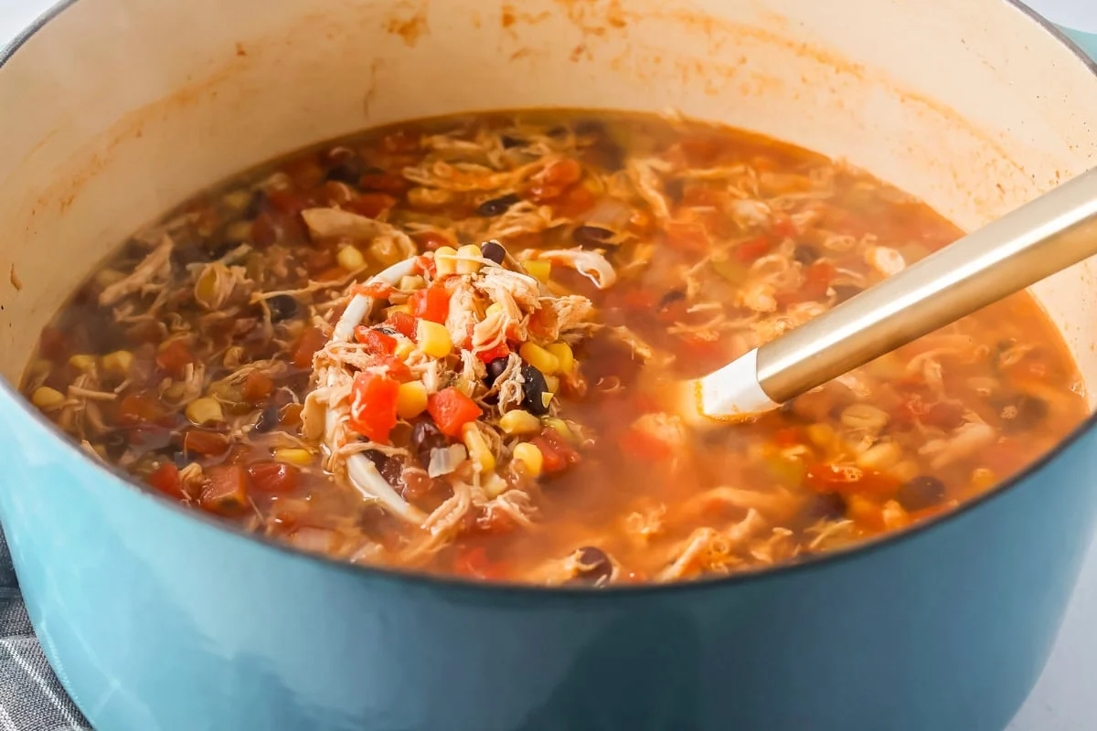 Easy chicken tortilla soup recipe in pot.