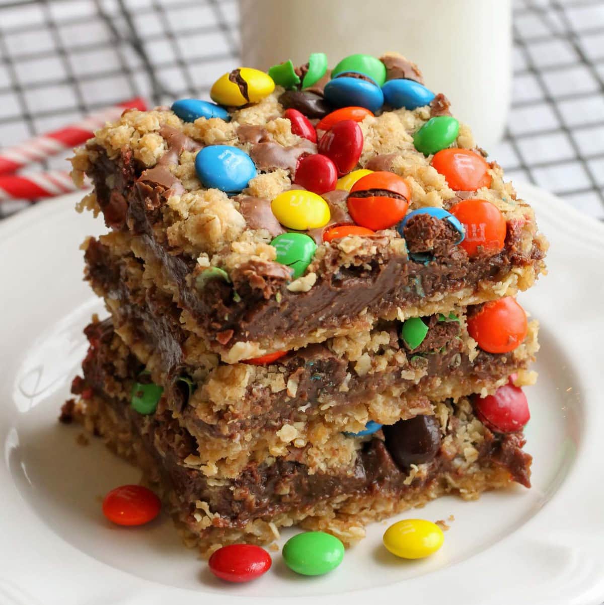 Cookie bar recipes - m&m chocolate bars stacked on a white plate.