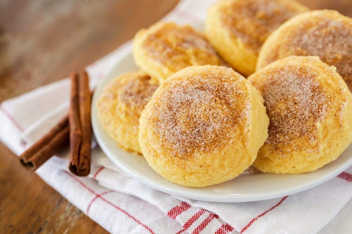 Easy cookie recipes - Cake mix snickerdoodle cookies piled onto a white plate.