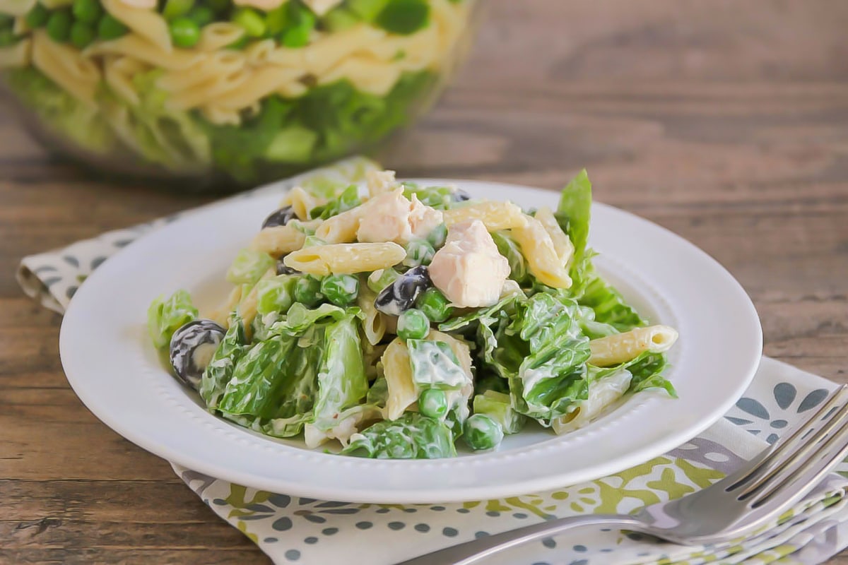 Layered Pea Salad scooped out onto a plate