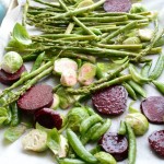 oven roasted vegetables including snap peas, asparagus, beets and brussel sprouts