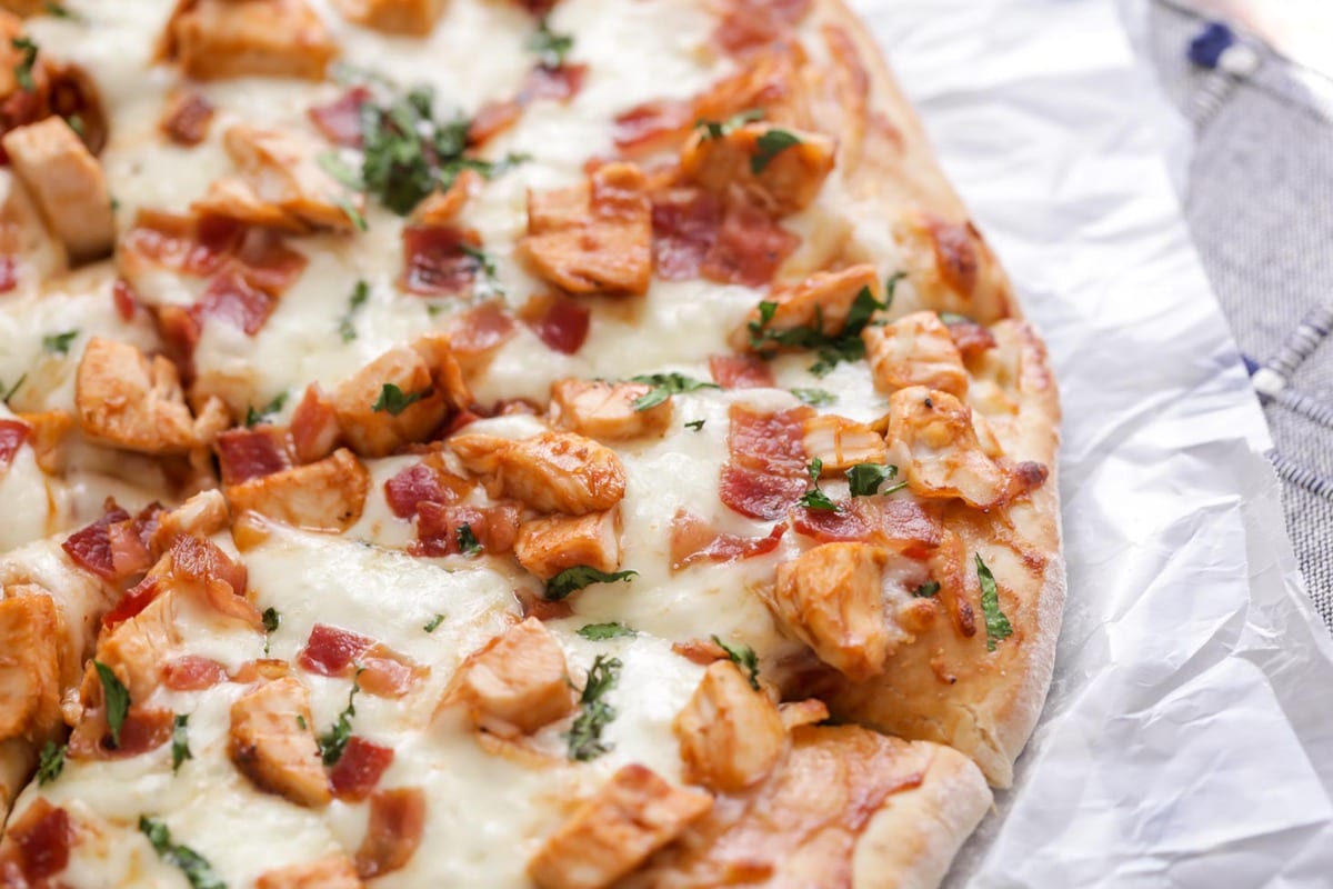 BBQ Chicken Pizza topped with bacon and cilantro.