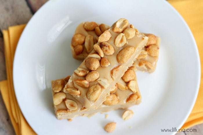 cut homemade pay day bars stacked on a white plate