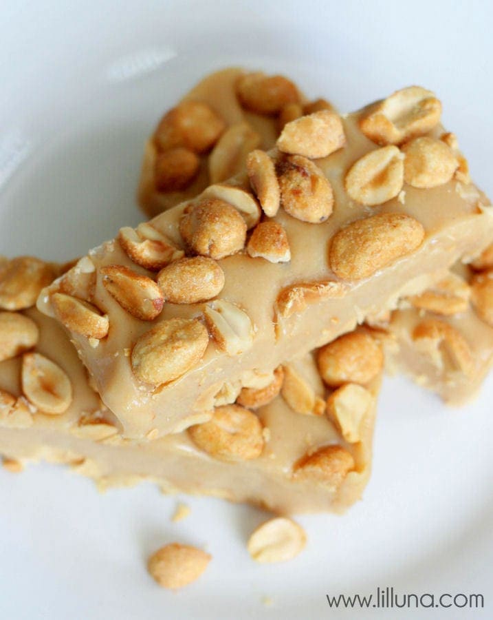 close up of homemade pay day bars stacked on a white plate