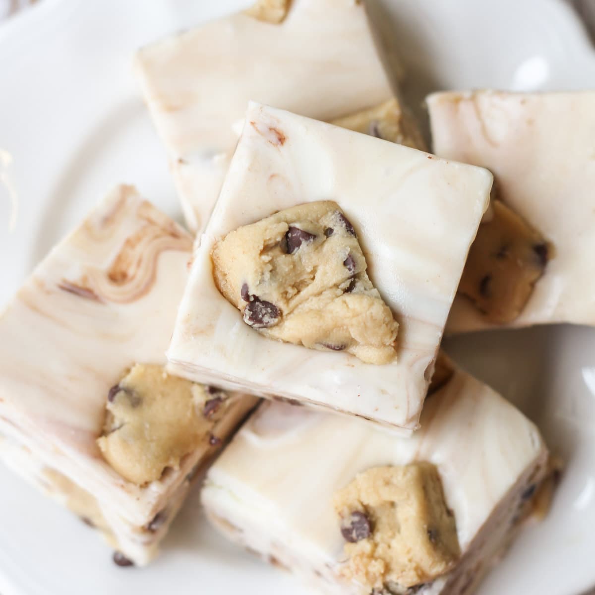 Chunks of cookie dough in cubes of white chocolate fudge