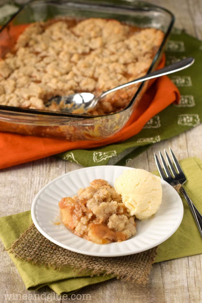 Peach dump cake - a scoop of apple dump cake served with vanilla ice cream.