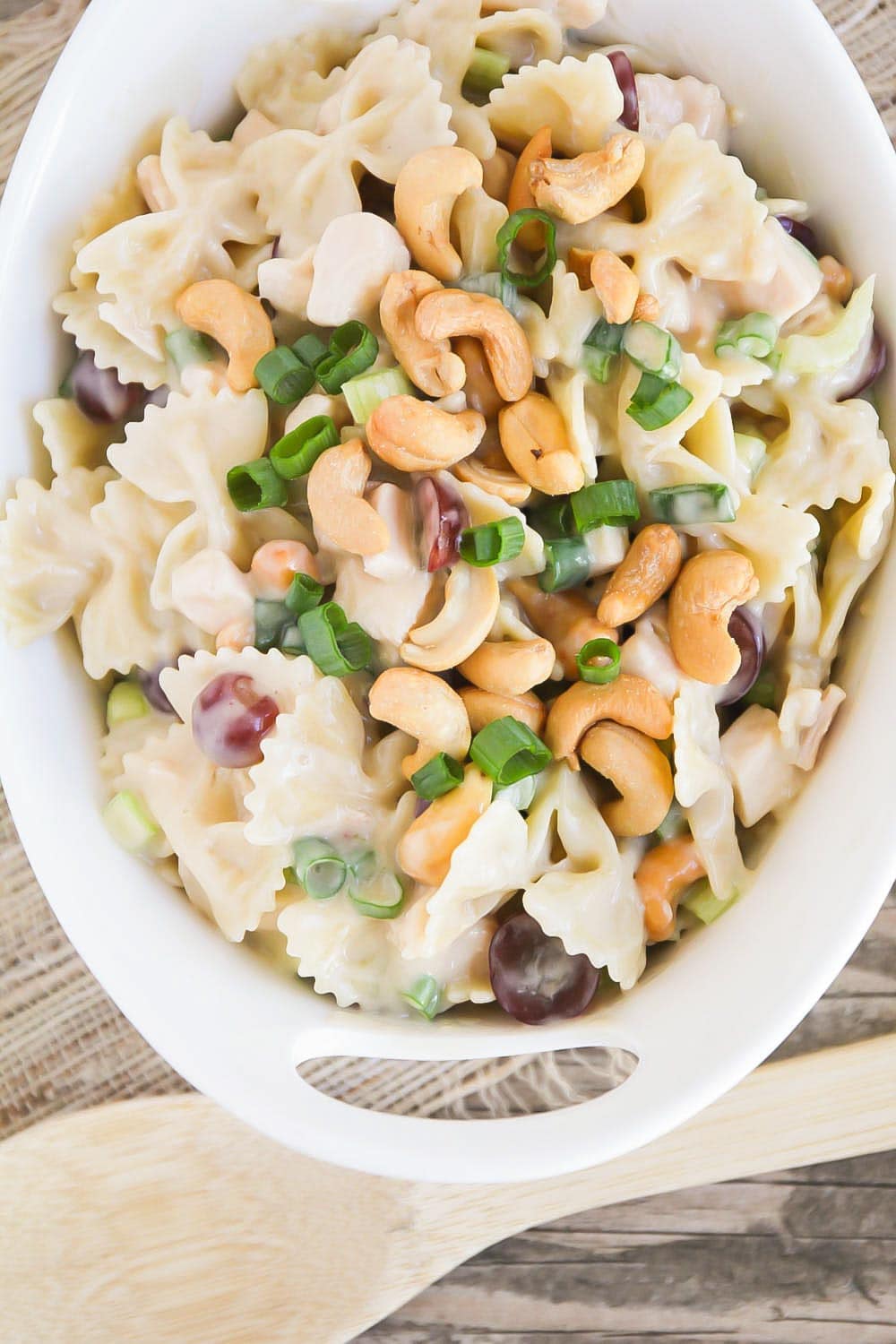 Cashew chicken salad recipe in white bowl.