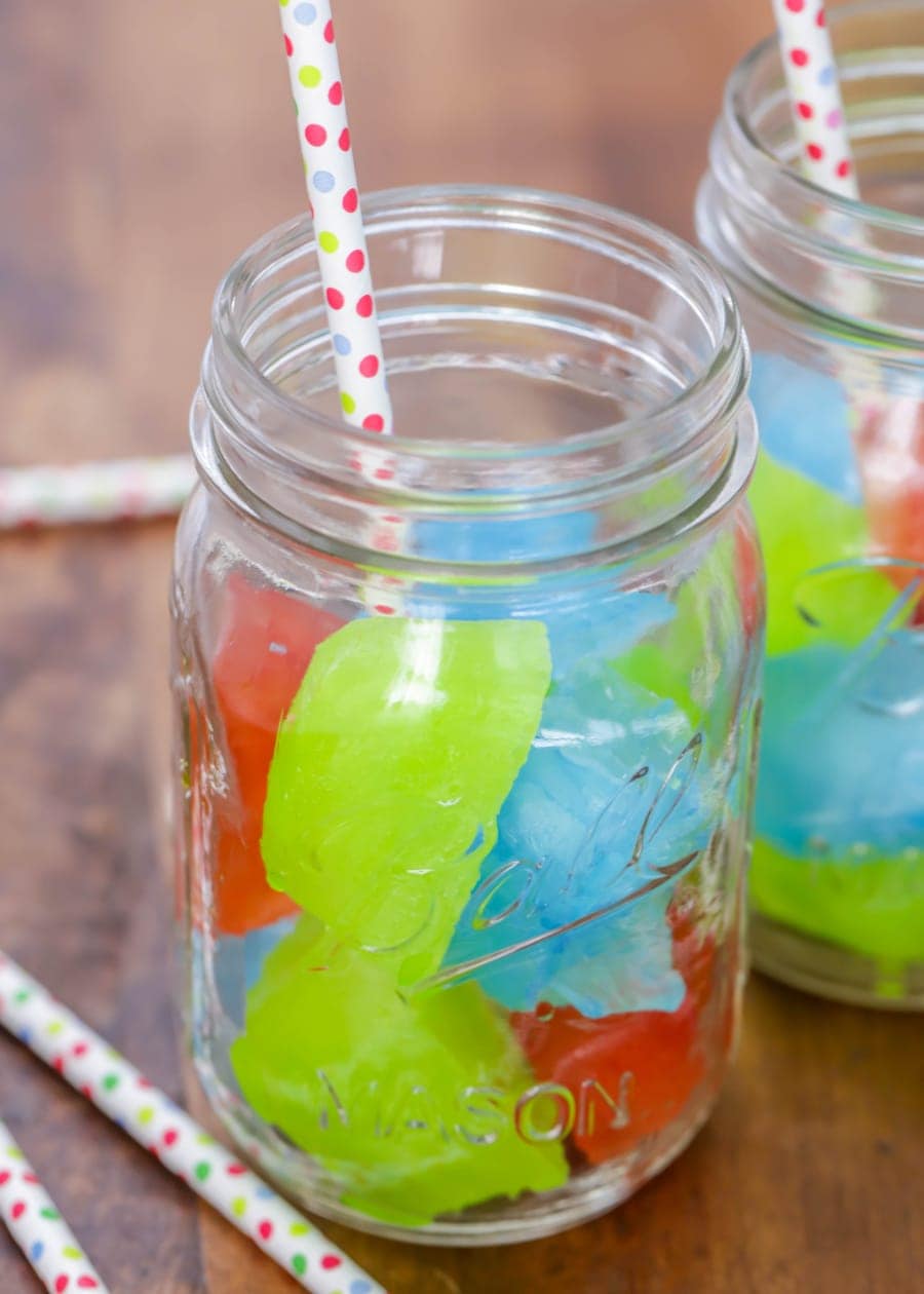 Holiday drink ideas - colored  kool aid ice in a mason jar.