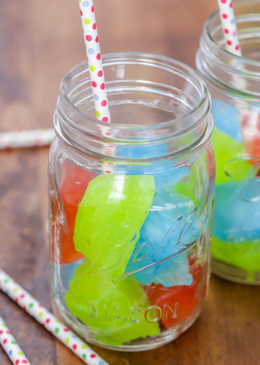 colored kool aid ice cubes in a mason jar