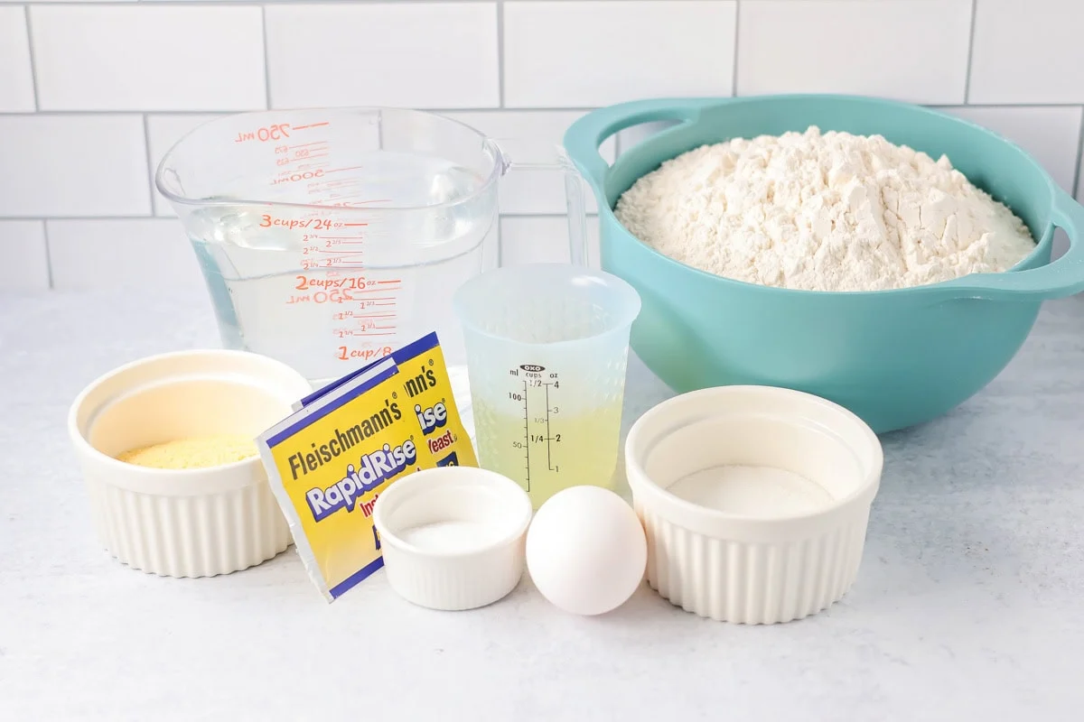 Homemade French bread recipe ingredients on counter.