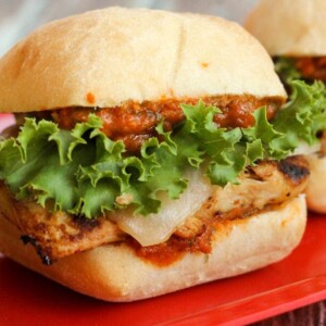 chicken parmesan slider with lettuce on red plate