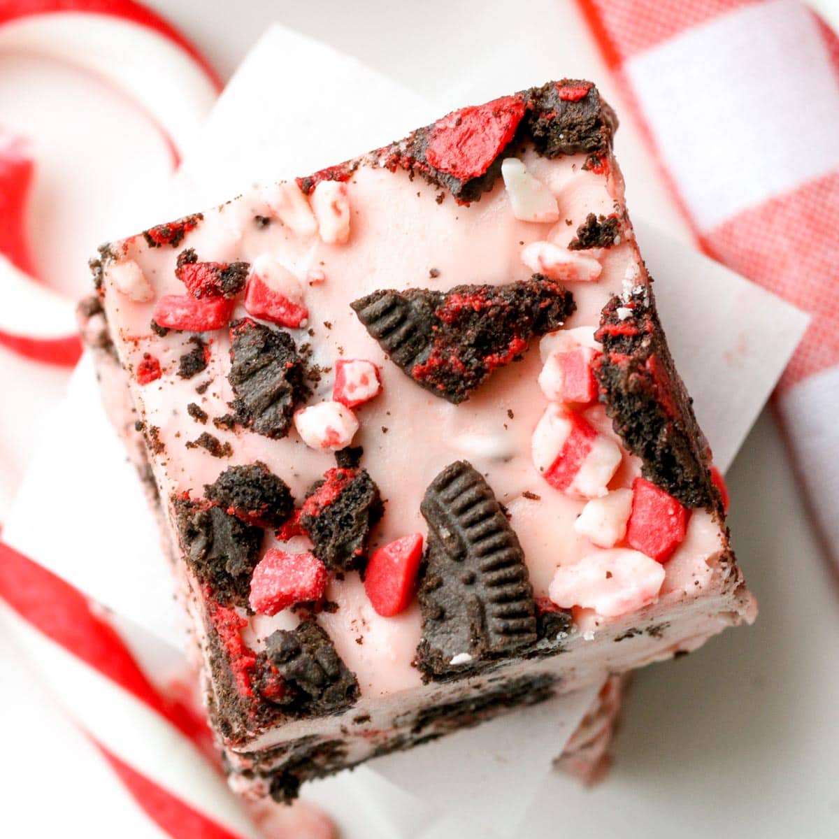 Christmas desserts - a square slice of peppermint oreo fudge on a plate.