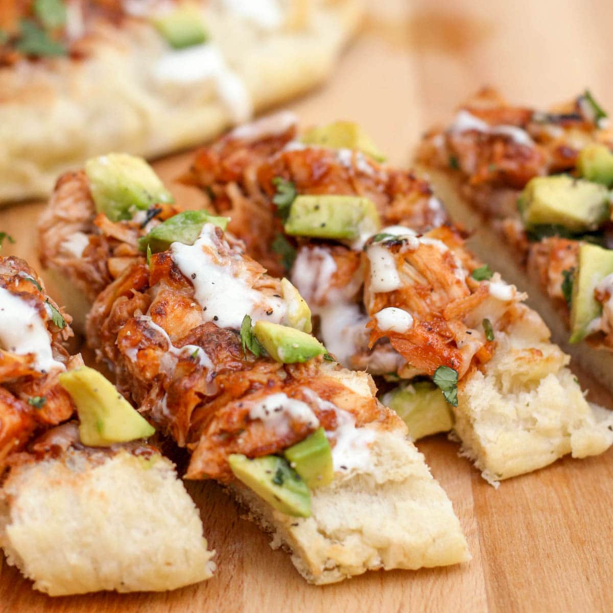 Barbecue chicken french bread sliced on a cutting board