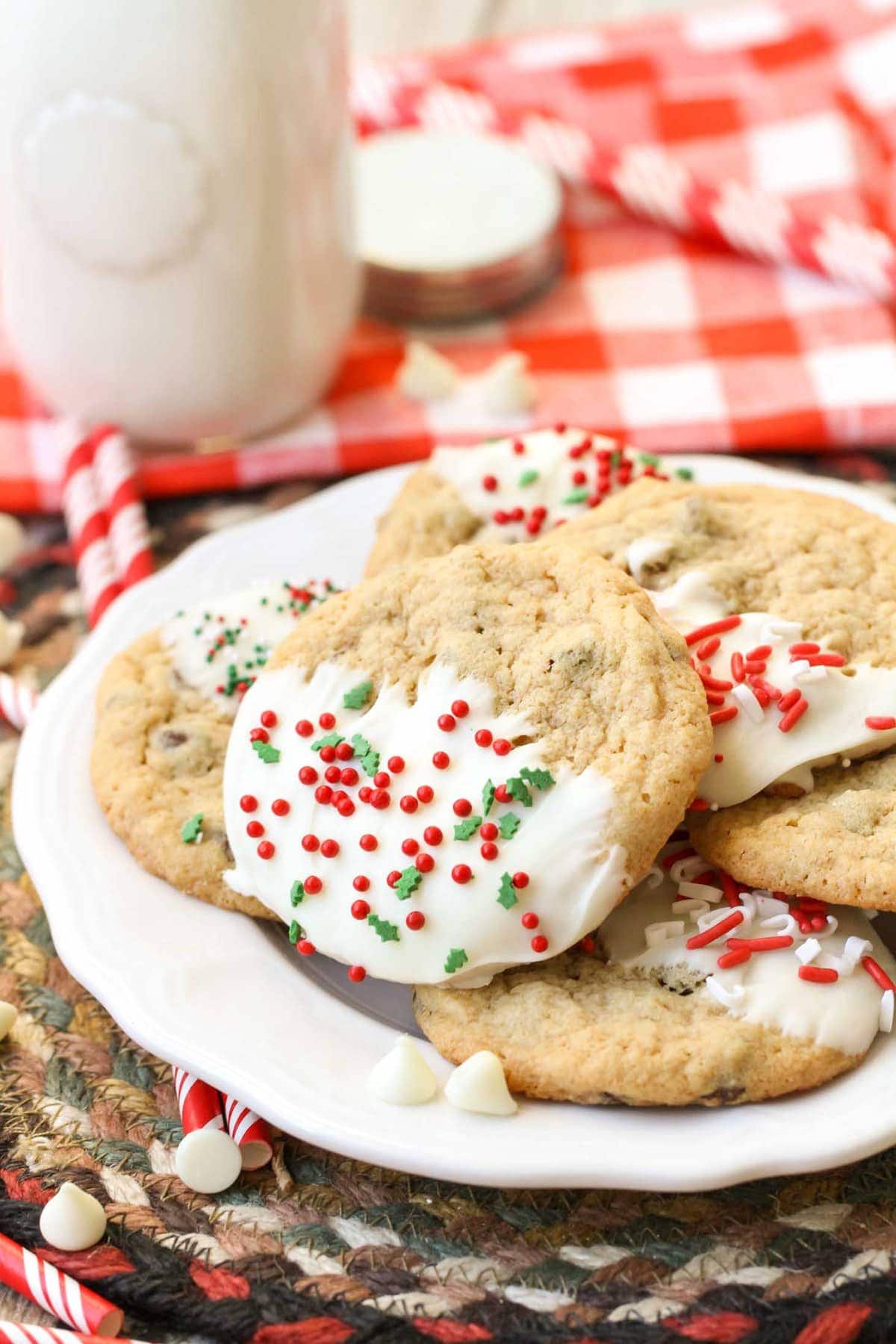 Christmas chocolate chip cookies dipped in candy coating with sprinkles.