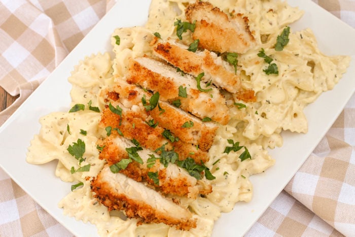 Close up of crispy chicken and pasta.