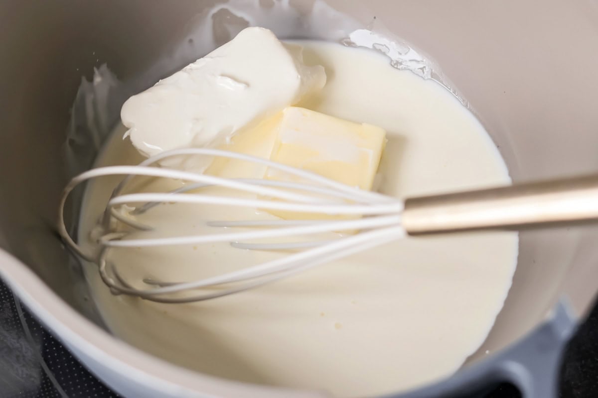 Making Alfredo Sauce in pan.
