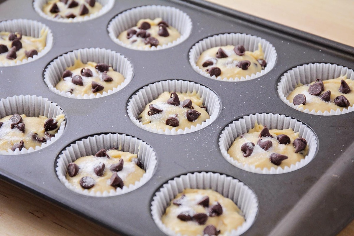 Homemade chocolate chip muffin batter in a baking tin