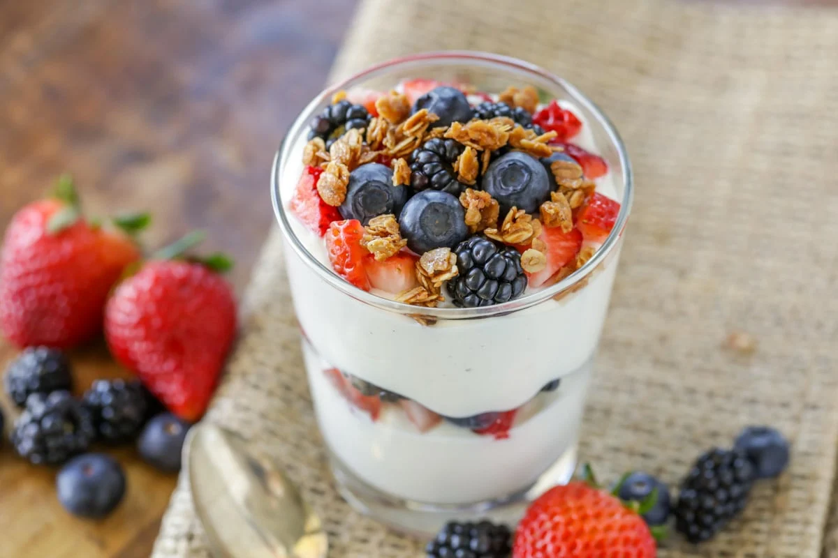 Yogurt parfait layered with fresh fruit and granola