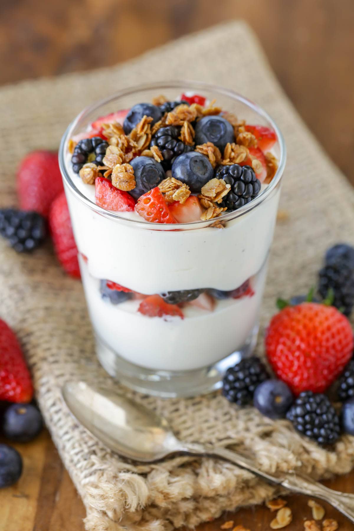 Yogurt parfait topped with fresh fruit and granola