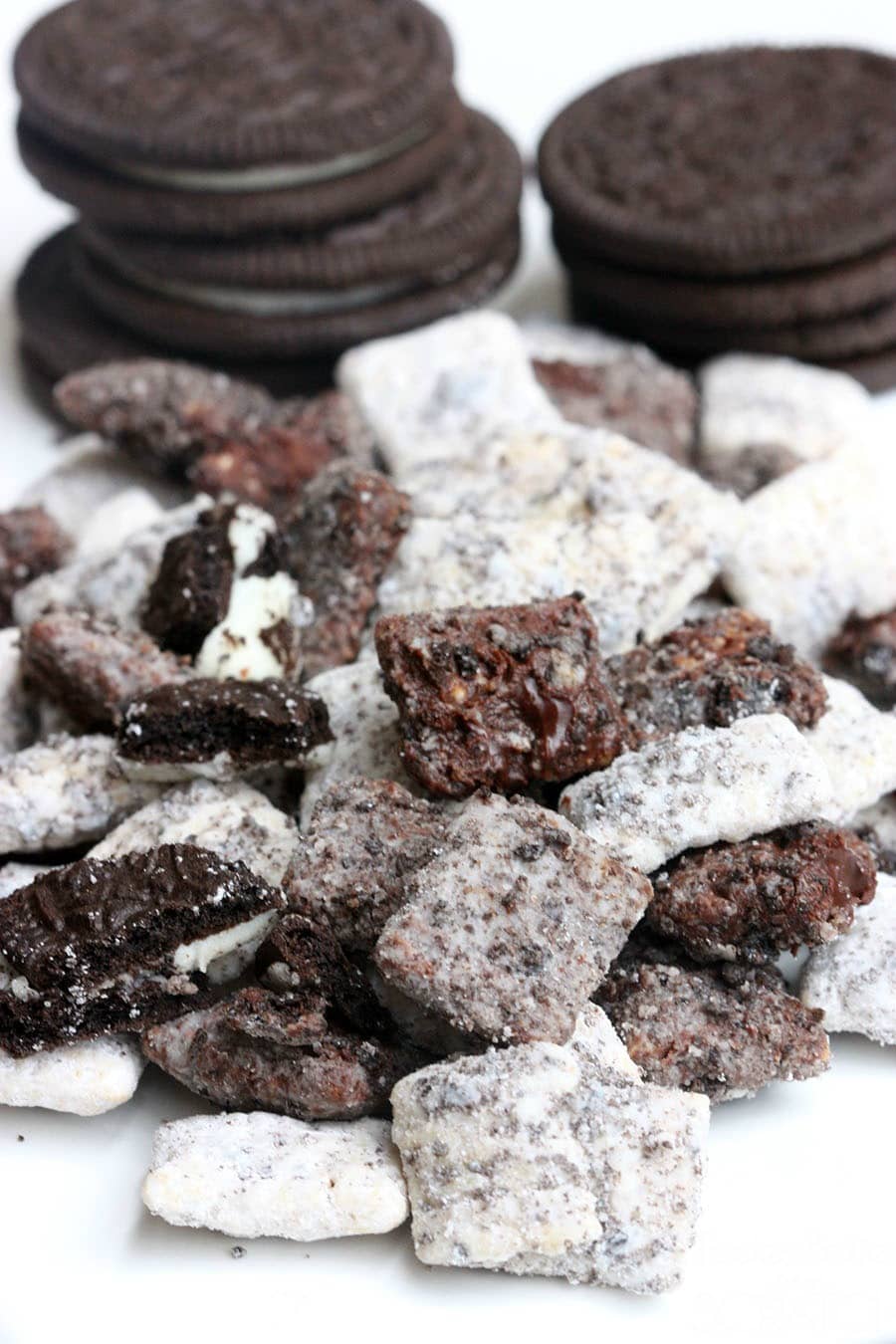 Oreo muddy Buddies with stacked Oreos in the background